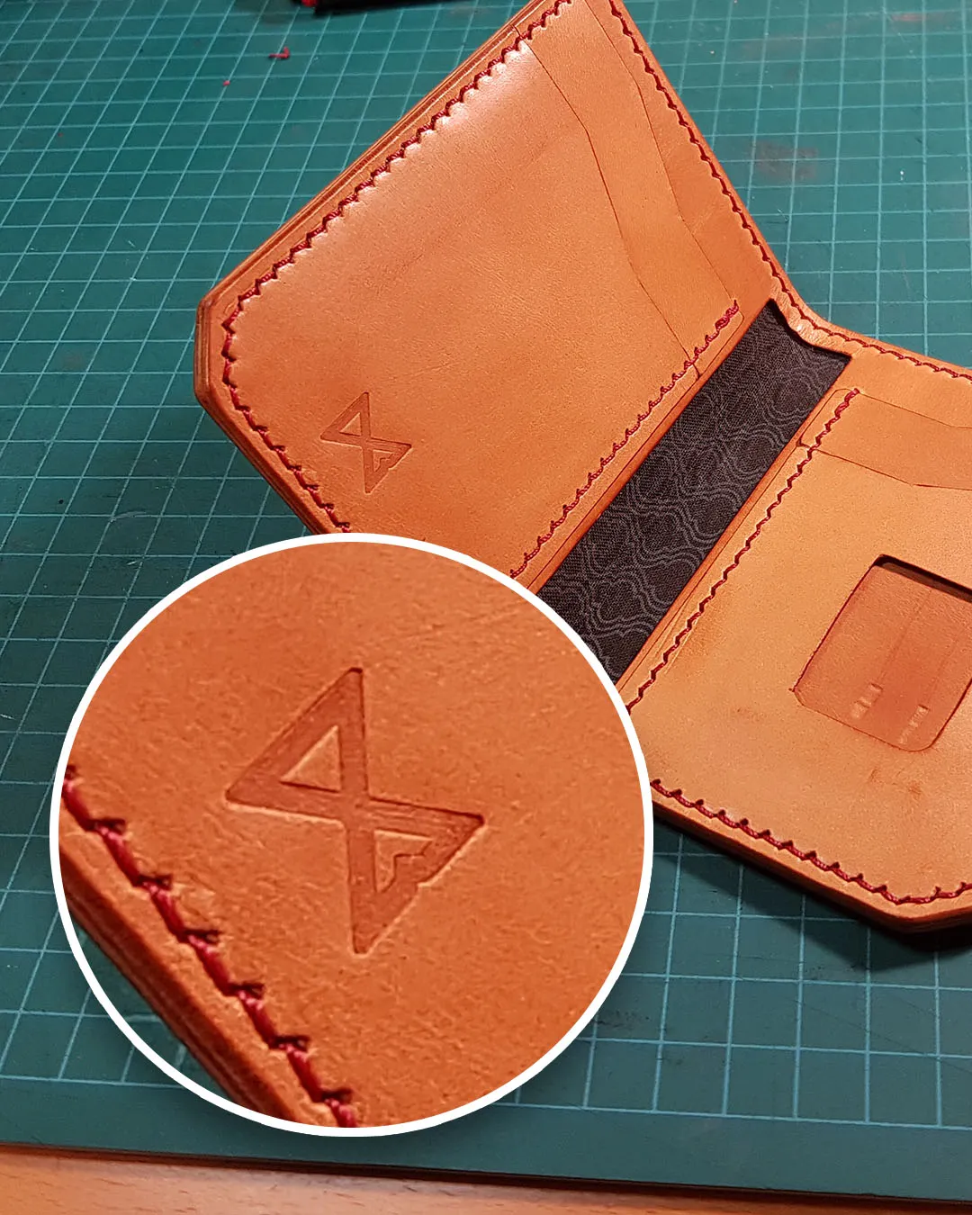 Tan leather wallet embossed with the Lonely Mountain Goods rune mark