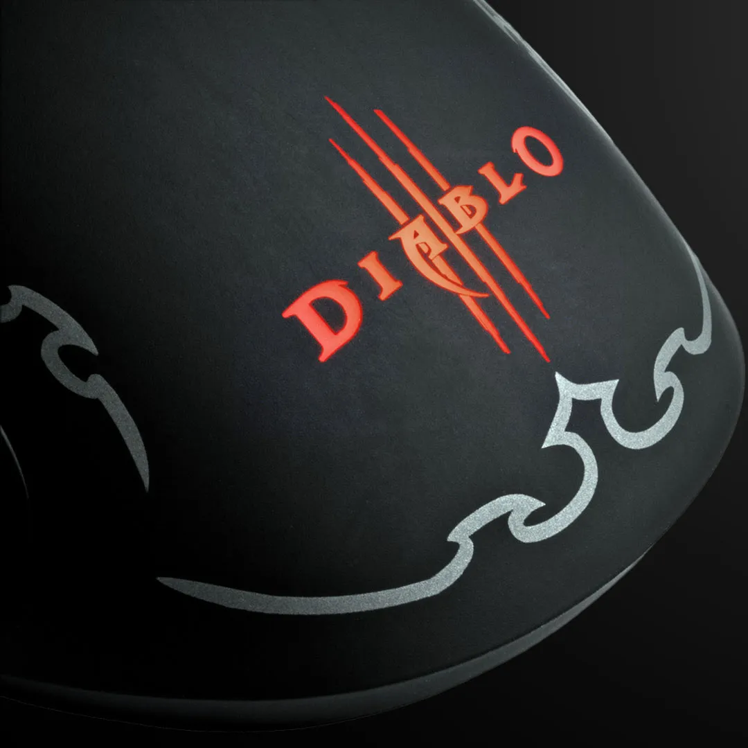 Close-up of the Diablo III logo glowing red and orange on a black mouse body