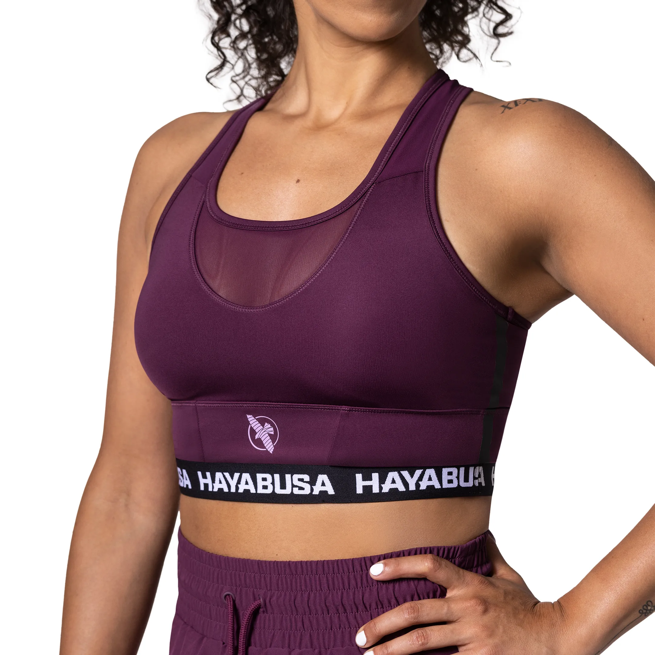 Women's purple sports bra with Hayabusa logo, product close-up on white