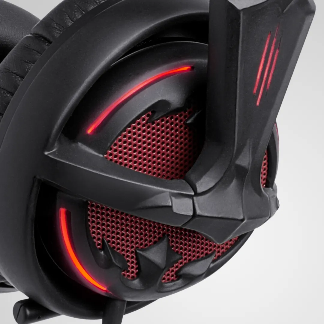 Diablo III headset ear-cup close-up with red illuminated mesh and a sculpted grille