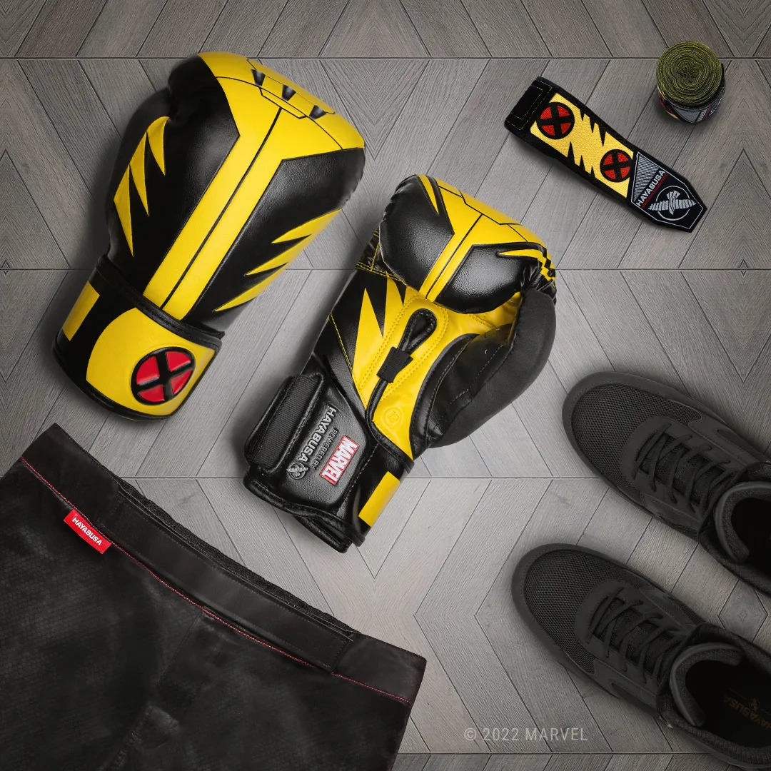 Wolverine gloves flat lay with hand wraps and training accessories
