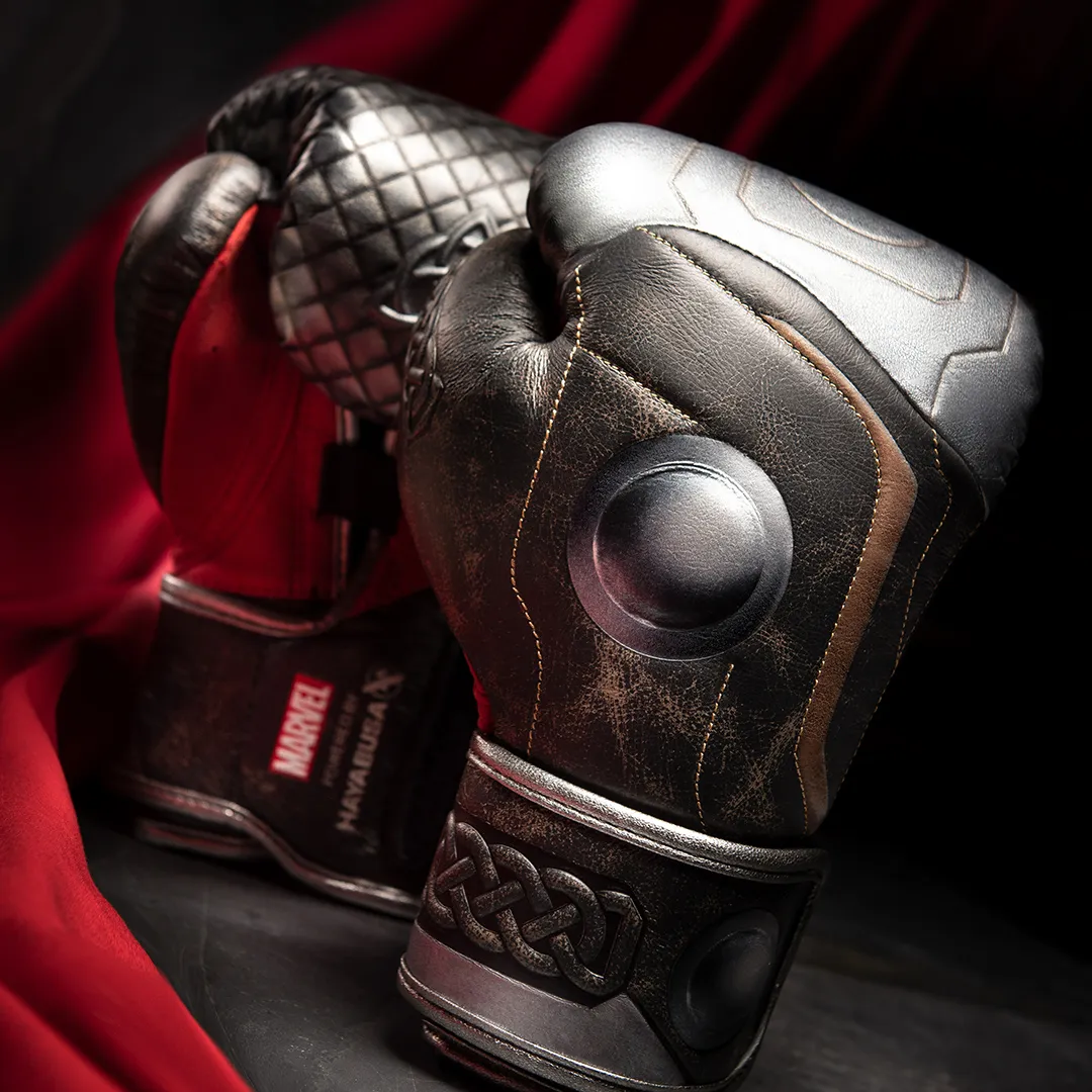 Thor training gloves detail in distressed leather with a Norse knotwork cuff and a metal disc emblem