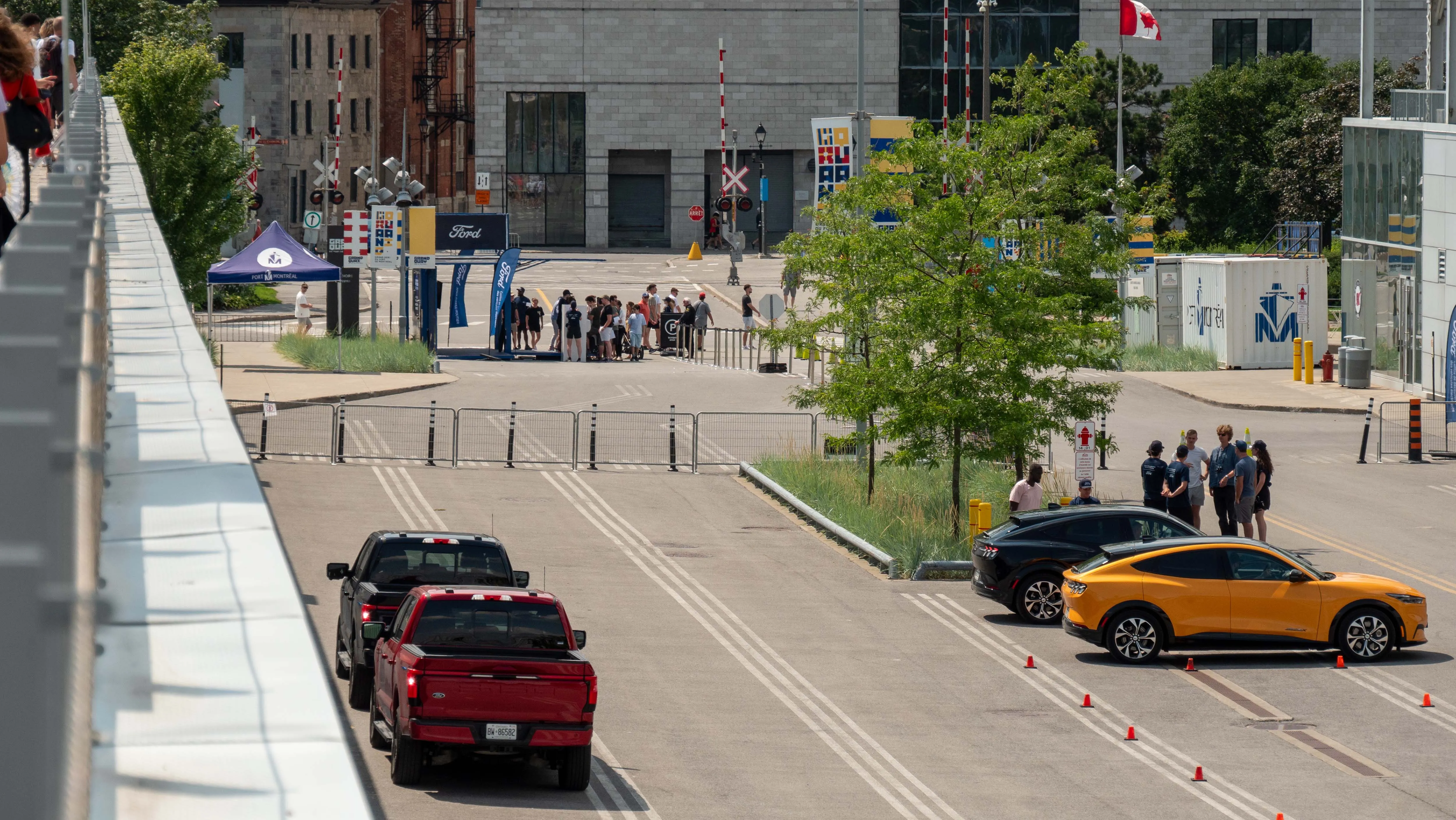 Aerial view of urban activation venue with Ford electric vehicles and crowd