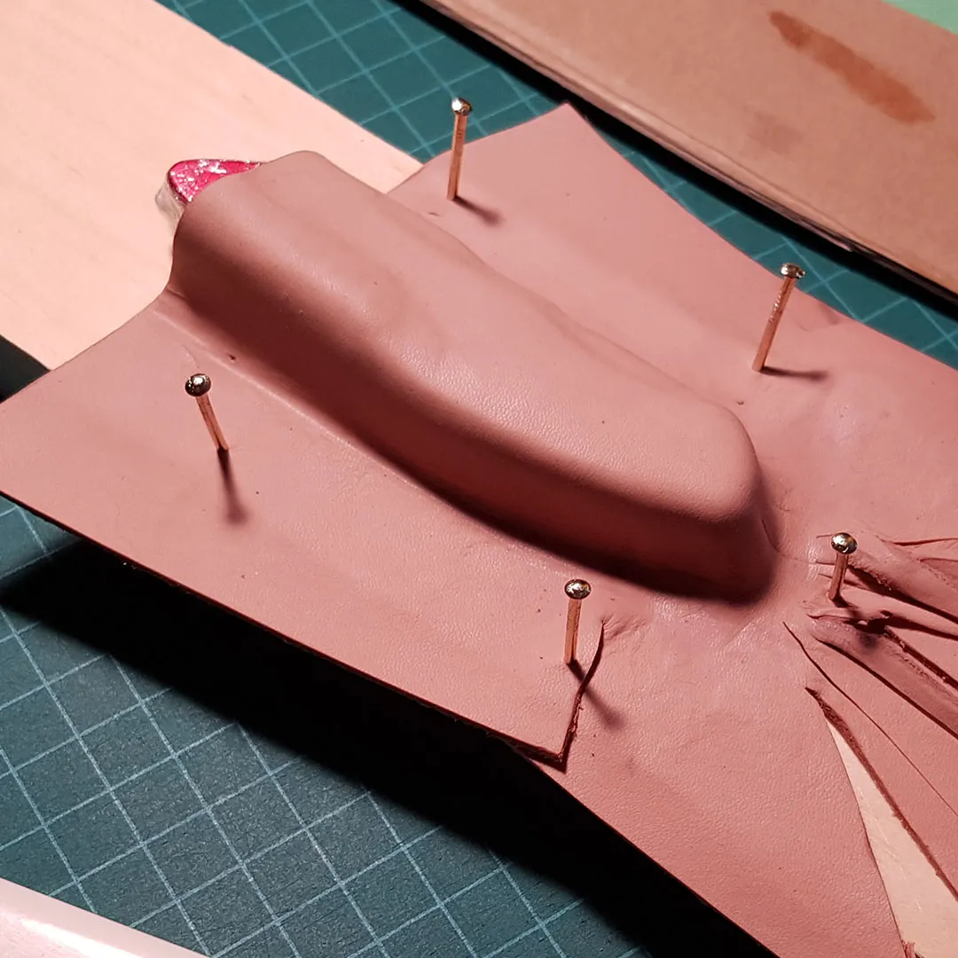 Cut and dyed sheath pieces laid out before assembly