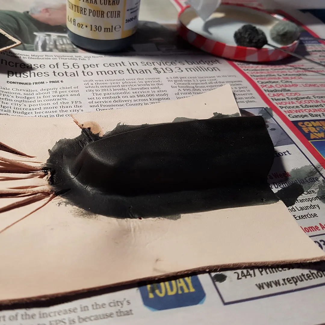Sheath body burnished and edge-painted before stitching