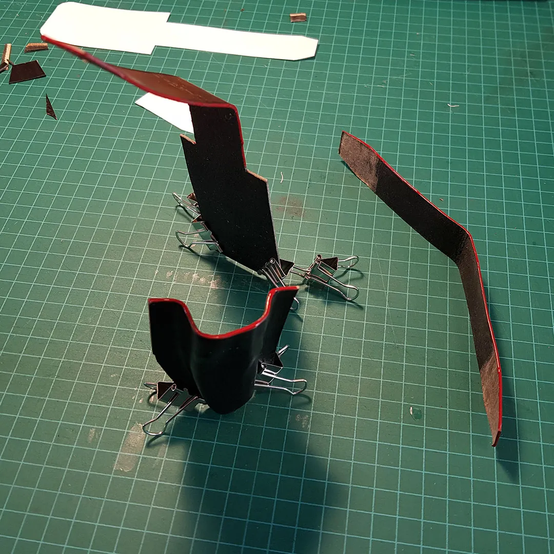 Sheath held in a stitching pony, saddle stitch in progress